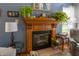 Elegant fireplace with a wooden mantel, tile hearth, and decorative accents providing a focal point in the cozy living space at 6006 Regency Dr, Columbus, IN 47203