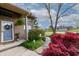 Attractive home with a blue front door, brick facade, manicured landscaping, and a stone walkway leading to the entrance at 6006 Regency Dr, Columbus, IN 47203