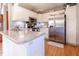 Updated kitchen with white cabinets, stainless steel refrigerator and lots of counter space at 6006 Regency Dr, Columbus, IN 47203