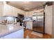 Well-lit kitchen features granite counters, stainless steel appliances, and white cabinetry at 6006 Regency Dr, Columbus, IN 47203