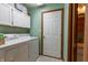 Functional laundry room featuring washer, dryer, cabinets, and easy access at 6006 Regency Dr, Columbus, IN 47203