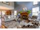 Inviting living room featuring a fireplace, comfortable seating, and views into the dining area, perfect for relaxation and entertaining at 6006 Regency Dr, Columbus, IN 47203