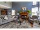 Comfortable living room featuring a fireplace, vaulted ceilings, and ample natural light offering a cozy and spacious atmosphere at 6006 Regency Dr, Columbus, IN 47203