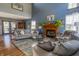 Cozy living room showcasing high ceilings, natural light, fireplace, and comfortable seating, creating an inviting living space at 6006 Regency Dr, Columbus, IN 47203