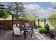 Outdoor patio with seating under the pergola and a tranquil fountain feature at 6006 Regency Dr, Columbus, IN 47203