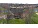 A beautifully landscaped home surrounded by mature trees has lake access at 6045 Channel Dr, Columbus, IN 47201
