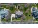 Stunning aerial view of a home on a meticulously landscaped lot with lake access and a private dock at 6045 Channel Dr, Columbus, IN 47201