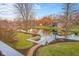 Picturesque backyard featuring a lake view and a private dock, perfect for outdoor enjoyment and water activities at 6045 Channel Dr, Columbus, IN 47201
