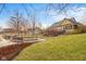 Expansive backyard with lush lawn, water feature and a large deck perfect for entertaining at 6045 Channel Dr, Columbus, IN 47201