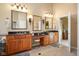 Spacious bathroom with double sinks, granite countertops, and wood cabinetry at 6045 Channel Dr, Columbus, IN 47201