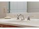 Bathroom vanity with a neutral countertop and elegant chrome faucet at 6045 Channel Dr, Columbus, IN 47201