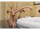 Detailed view of a bathroom faucet, highlighting its elegant design and finish alongside a porcelain sink at 6045 Channel Dr, Columbus, IN 47201