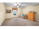 Bright bedroom features a ceiling fan, a window with a blind, and ample space for relaxation at 6045 Channel Dr, Columbus, IN 47201