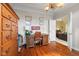 Bedroom with hardwood floors, desk and a view into a living room at 6045 Channel Dr, Columbus, IN 47201