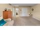 Spacious bedroom featuring carpet, an ensuite bathroom, and natural light, offering a comfortable retreat at 6045 Channel Dr, Columbus, IN 47201