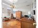 Bedroom featuring a desk, chest of drawers, hardwood floors, and natural light at 6045 Channel Dr, Columbus, IN 47201