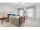 Cozy bedroom with a classic wooden bed frame and decorative wall art at 6045 Channel Dr, Columbus, IN 47201