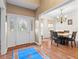Foyer leading to dining area featuring hardwood flooring, a decorative door and ample natural light at 6045 Channel Dr, Columbus, IN 47201