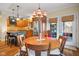 Eat-in kitchen featuring a center island, stainless steel appliances, and access to the outdoor patio at 6045 Channel Dr, Columbus, IN 47201