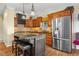 Charming kitchen featuring a granite island, custom cabinets, and stainless steel appliances at 6045 Channel Dr, Columbus, IN 47201
