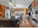 Eat-in kitchen with granite island, stainless appliances, and a dining area with great natural light at 6045 Channel Dr, Columbus, IN 47201