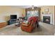 Comfortable living room showcasing a fireplace, carpeted floors, and a view to the rear patio through french doors at 6045 Channel Dr, Columbus, IN 47201