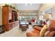 Bright living room with vaulted ceilings, built-in shelving, and a cozy sectional sofa at 6045 Channel Dr, Columbus, IN 47201