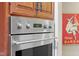 Close up of oven appliance featuring stainless steel and knobs with cooking display and settings at 6045 Channel Dr, Columbus, IN 47201