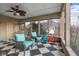 Inviting porch offers cozy seating, a ceiling fan, and views of the surrounding neighborhood at 6045 Channel Dr, Columbus, IN 47201