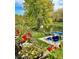 Beautiful view of waterfront property with boat and a variety of plants in boxes on the porch at 6045 Channel Dr, Columbus, IN 47201