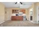 Finished basement featuring custom wet bar with ample cabinet space and modern appliances at 6045 Channel Dr, Columbus, IN 47201