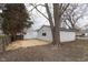 View of a backyard with a detached garage, offering practical outdoor space at 650 S Lyons Ave, Indianapolis, IN 46241