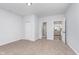 Spacious bedroom with carpet, an ensuite bathroom, and modern lighting at 650 S Lyons Ave, Indianapolis, IN 46241