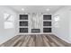 Living room featuring a decorative marble accent wall, modern flooring and lots of natural light at 650 S Lyons Ave, Indianapolis, IN 46241