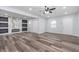 A cozy living room featuring modern flooring, fresh paint, fireplace and lots of natural light at 650 S Lyons Ave, Indianapolis, IN 46241