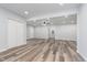 Bright living room featuring modern flooring, fresh paint, and a ceiling fan at 650 S Lyons Ave, Indianapolis, IN 46241