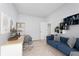 Modern office space with comfortable sofa, workspace, and storage shelves at 650 S Lyons Ave, Indianapolis, IN 46241