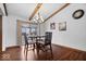 Elegant dining room with a stylish chandelier and sliding door access to the outdoors for easy entertaining at 7326 Caboose Ct, Indianapolis, IN 46256