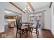 Inviting dining room featuring hardwood floors, a chandelier, and sliding doors to a sunroom at 7326 Caboose Ct, Indianapolis, IN 46256