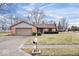 Lovely single-story brick home with attached garage, tidy landscaping, and concrete driveway at 7326 Caboose Ct, Indianapolis, IN 46256