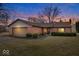 Cozy brick home featuring an attached garage and neatly trimmed bushes, perfect for curb appeal at 7326 Caboose Ct, Indianapolis, IN 46256