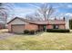 Charming brick home with an attached garage, manicured landscaping, and a well-maintained lawn at 7326 Caboose Ct, Indianapolis, IN 46256