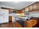 Kitchen featuring stainless steel appliances, an island with knife storage, and ample cabinet space at 7326 Caboose Ct, Indianapolis, IN 46256