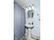 Bathroom with pedestal sink and tiled shower at 764 E 42Nd St, Indianapolis, IN 46205