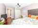 Cozy bedroom featuring a desk, gray walls, carpet, and a closet at 764 E 42Nd St, Indianapolis, IN 46205