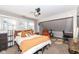 Cozy bedroom with ample natural light, a ceiling fan, and a comfy reading nook at 764 E 42Nd St, Indianapolis, IN 46205