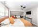 Bright bedroom with reading chair, desk, television, and comfortable bed at 764 E 42Nd St, Indianapolis, IN 46205