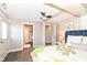 Bright bedroom with carpet, a closet, and a door to a half bath at 764 E 42Nd St, Indianapolis, IN 46205