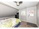 Bedroom with a bed, desk, television, carpet and natural light at 764 E 42Nd St, Indianapolis, IN 46205