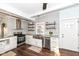 Bright kitchen with stainless appliances, granite countertops, and stylish shelving at 764 E 42Nd St, Indianapolis, IN 46205